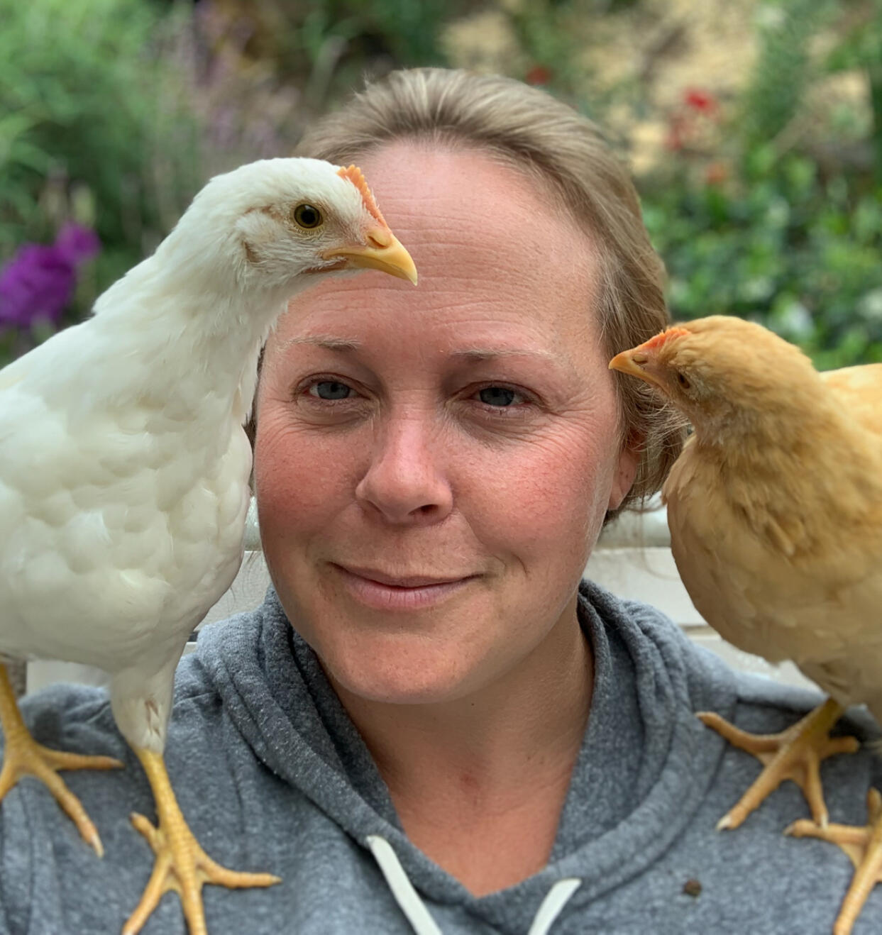 Rynell Nunez with two of her chickens