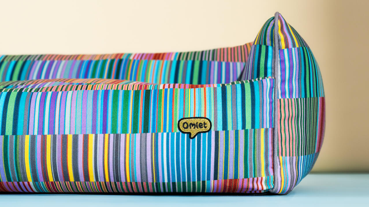 vibrant nest dog bed in pawsteps electric pattern