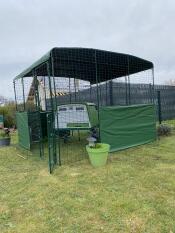 The Eglu Cube chicken coop set up with the Walk In Run.