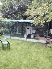 The heavy duty chicken run cover attached to a large walk in chicken run enclosure.