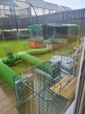 The Zippi rabbit tunnel connecting a hutch and a rabbit play pen.
