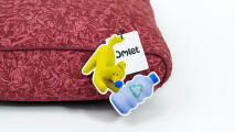 detail of recycled plastic bottle tag on sustainable dog bed