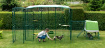 A women in an Omlet walk in chicken run.