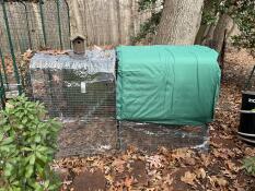 The green extreme temperature jacket on the Eglu Cube chicken coop.
