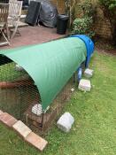A heavy duty cover on the run of a chicken coop