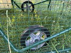 Close up of wheels attached to Eglu Go UP chicken coop frame.