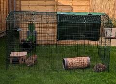 The double height Zippi rabbit run set up in a garden.