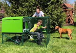 Lady, boy, dog and their Omlet Green Eglu Cube Large Chicken Coop and Run